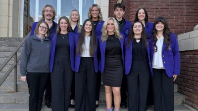 DECA team on stairs 2026