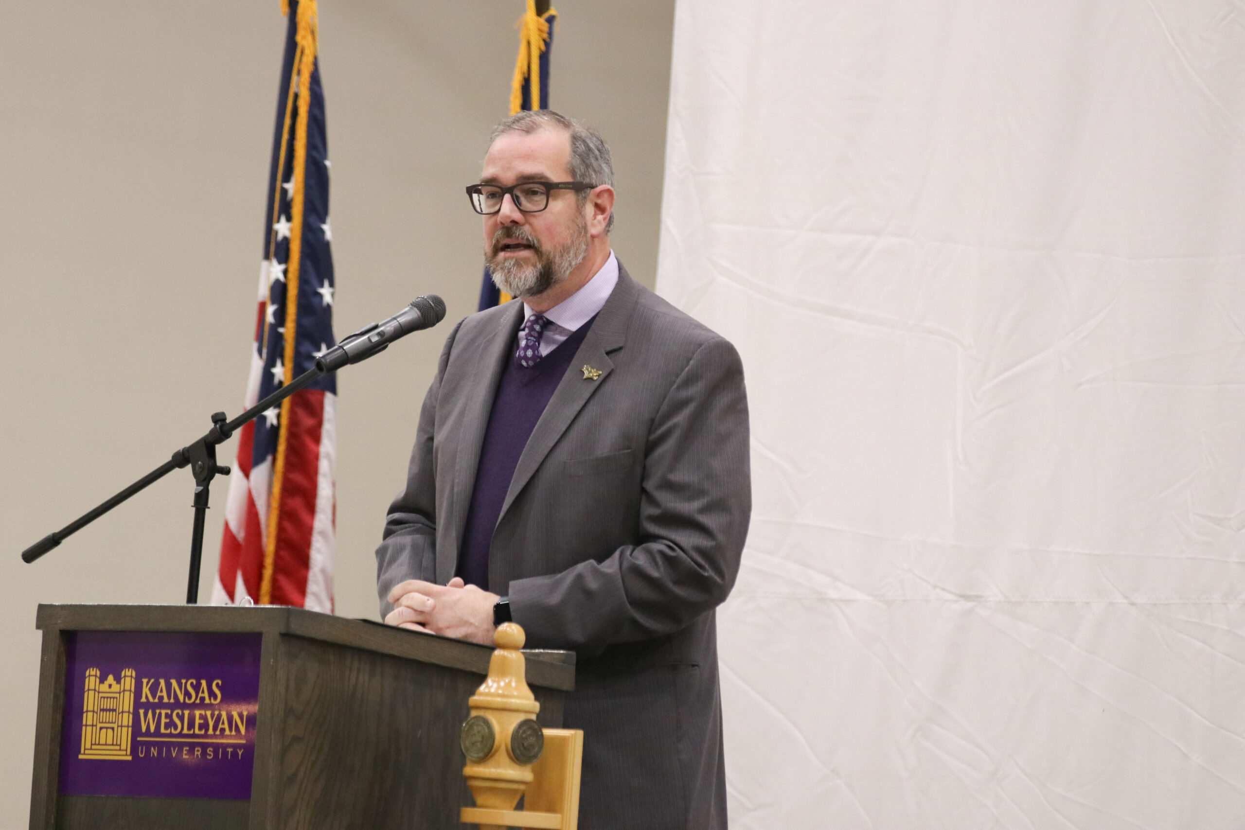 Man speaking at podium