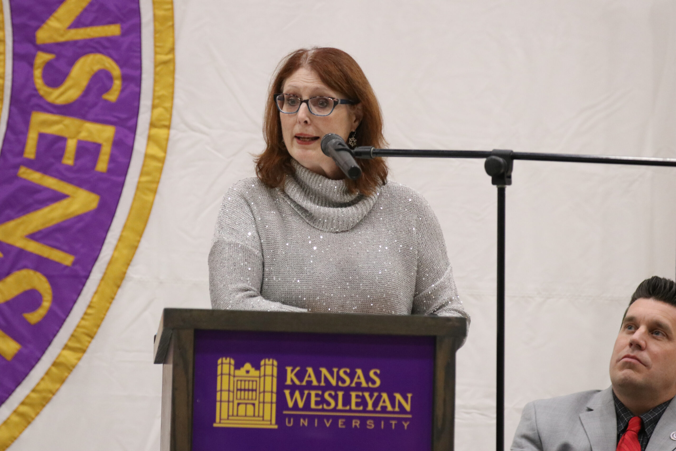 Woman speaking at podium