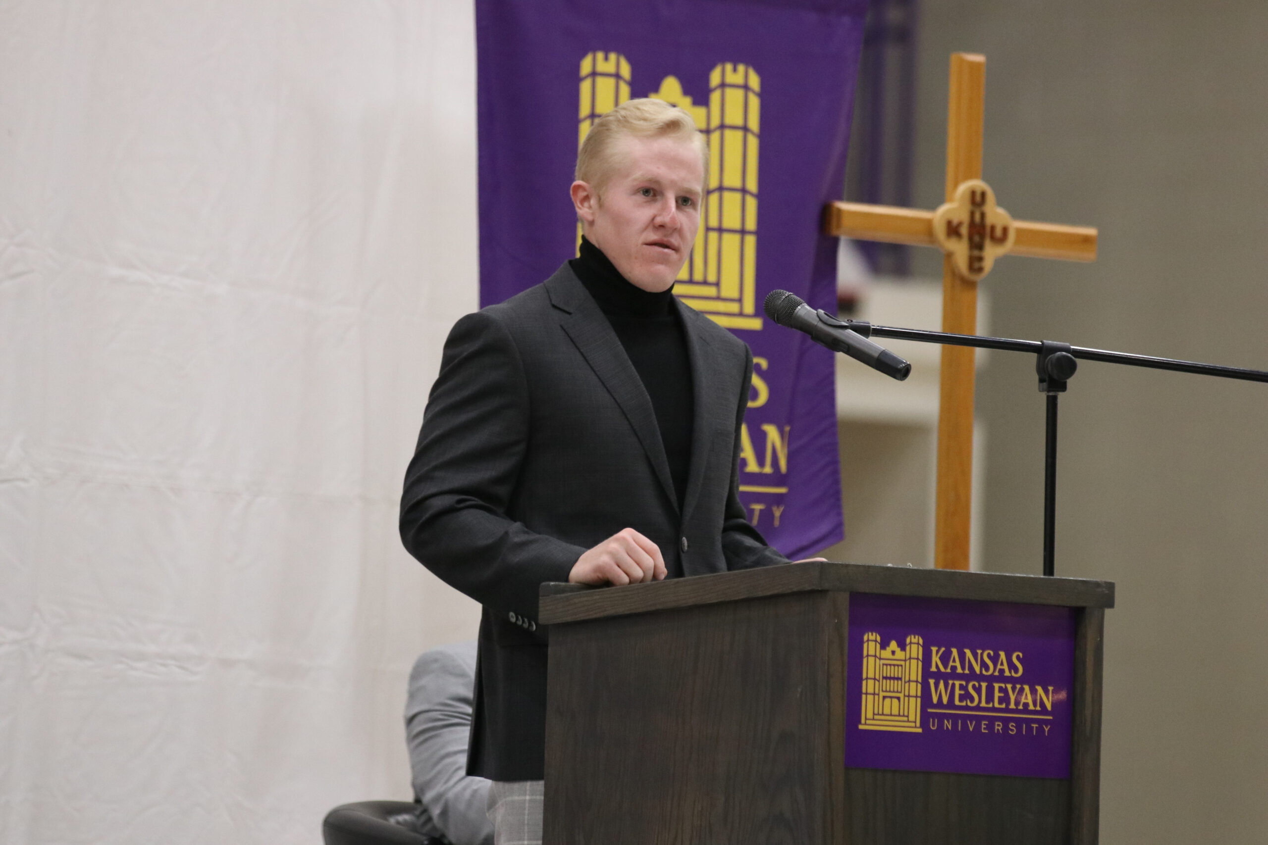 Man speaking at podium