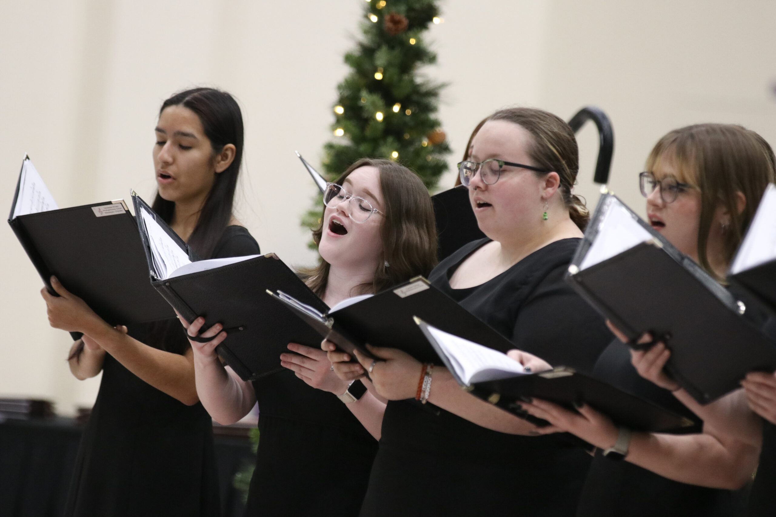 Three individuals singing