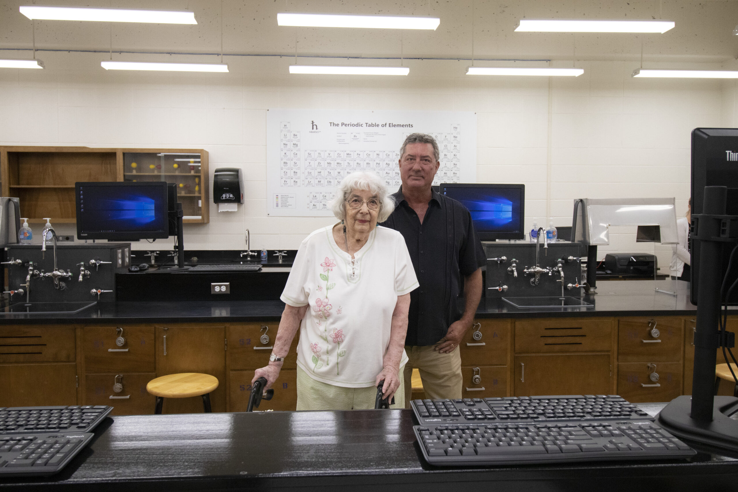 Barbara Hauptli and son inside chemistry lab