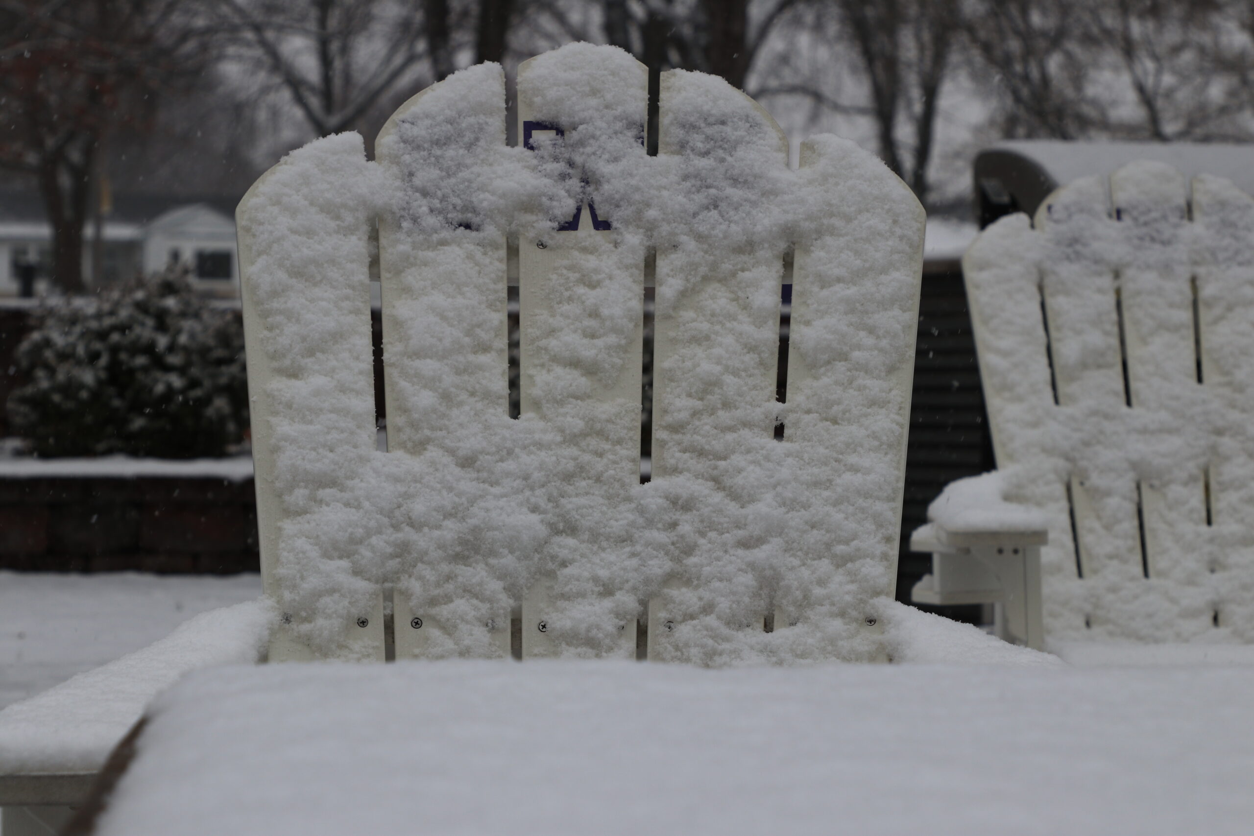 Snow on chair outside