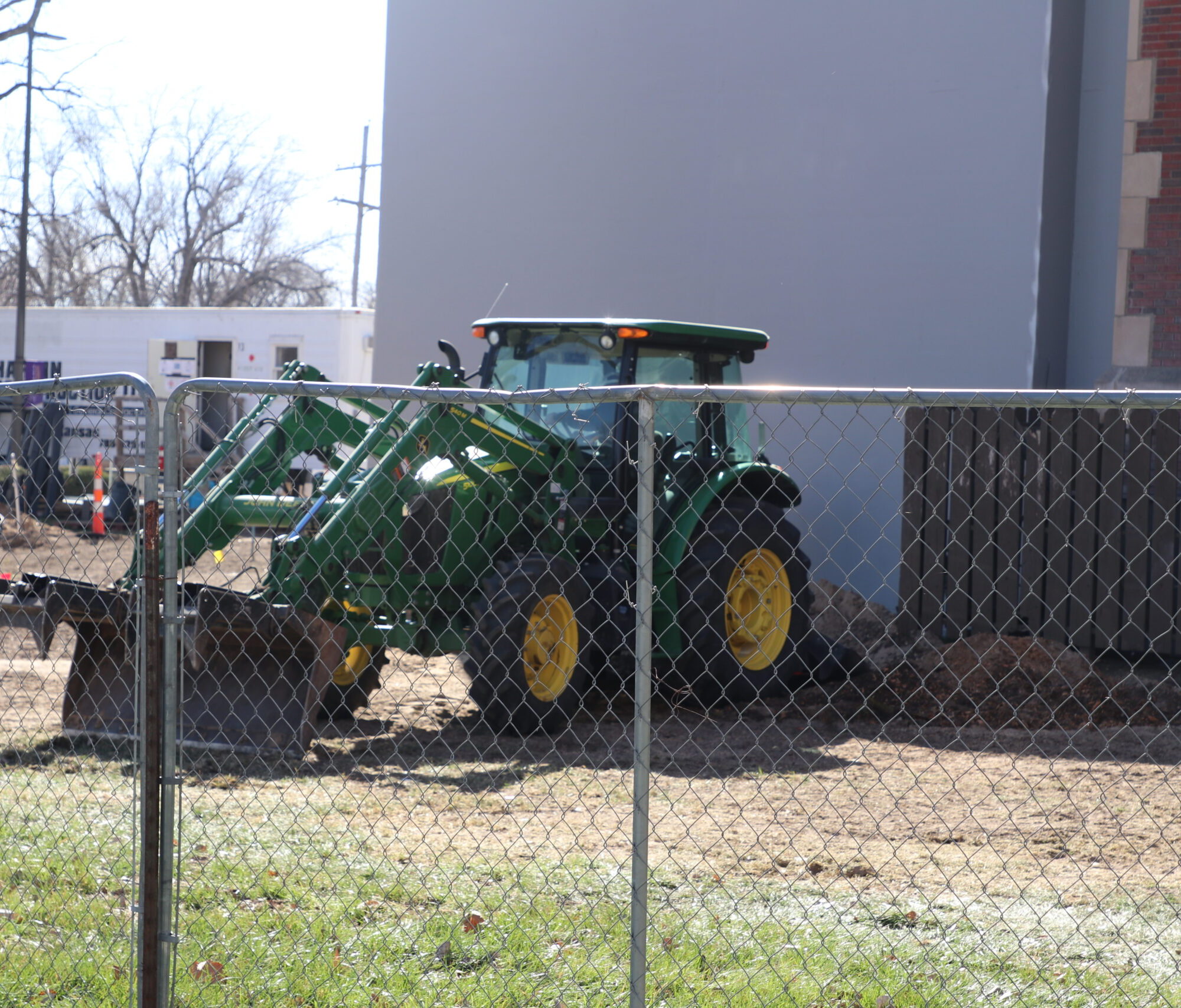 Front loader digging dirt