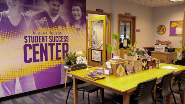 Room with a table with various projects visible