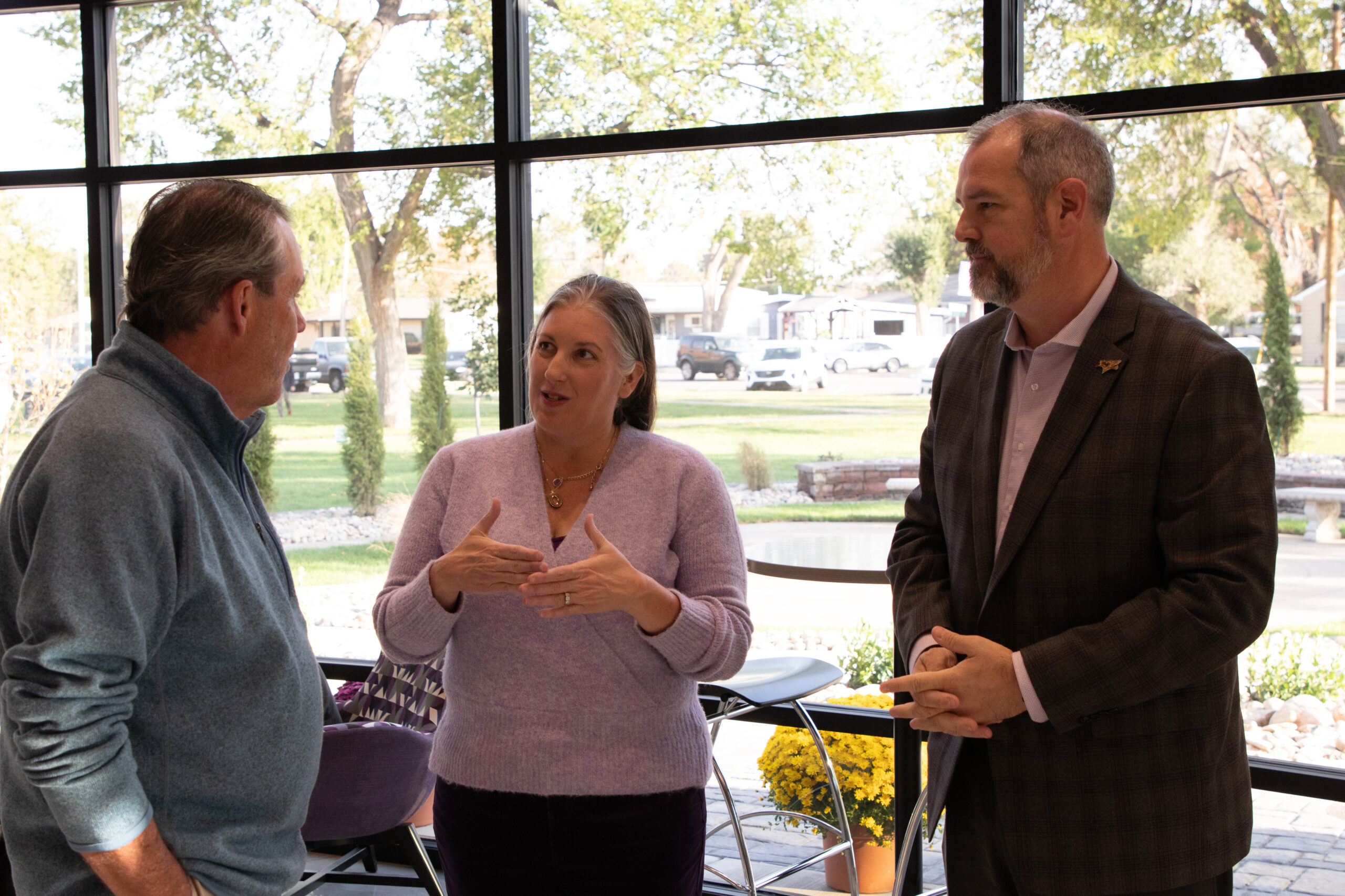 KWU president talking with folks in Bieber Hall