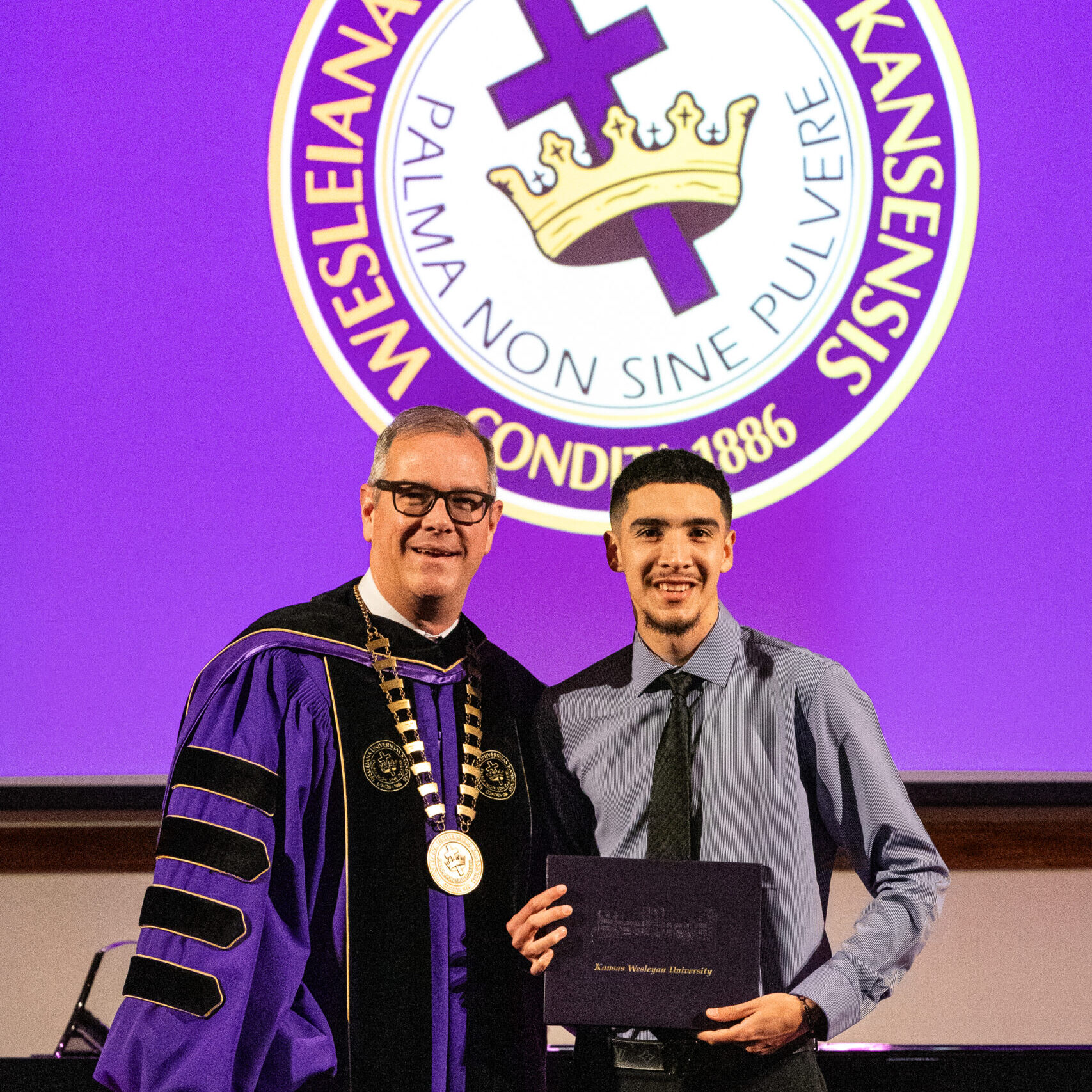 Man with diploma and president