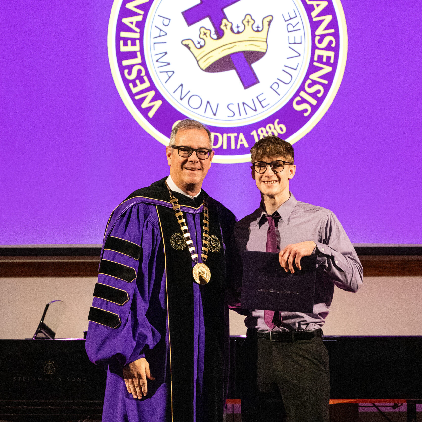 Man with diploma and president