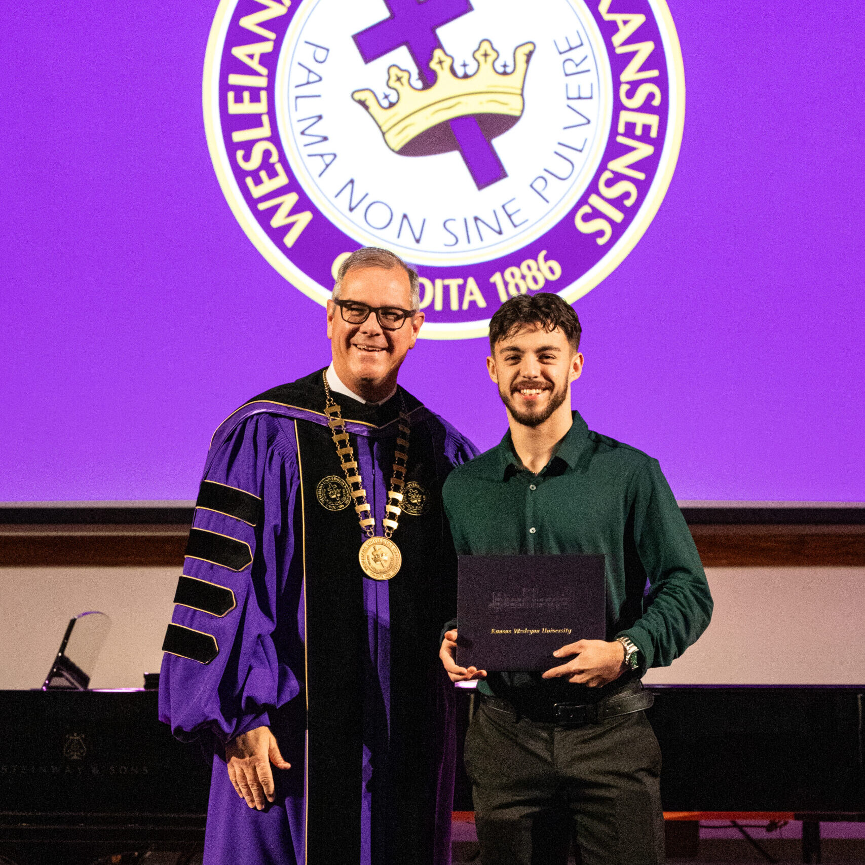 Man with diploma and president