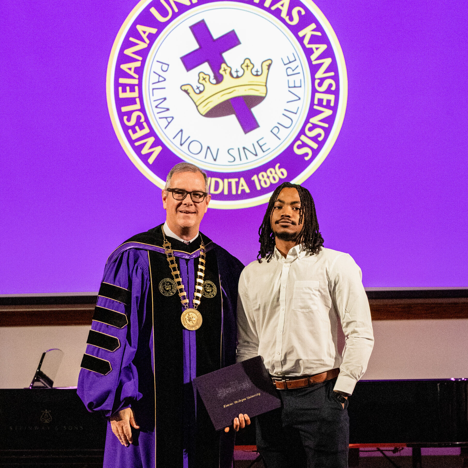 Man with diploma and president