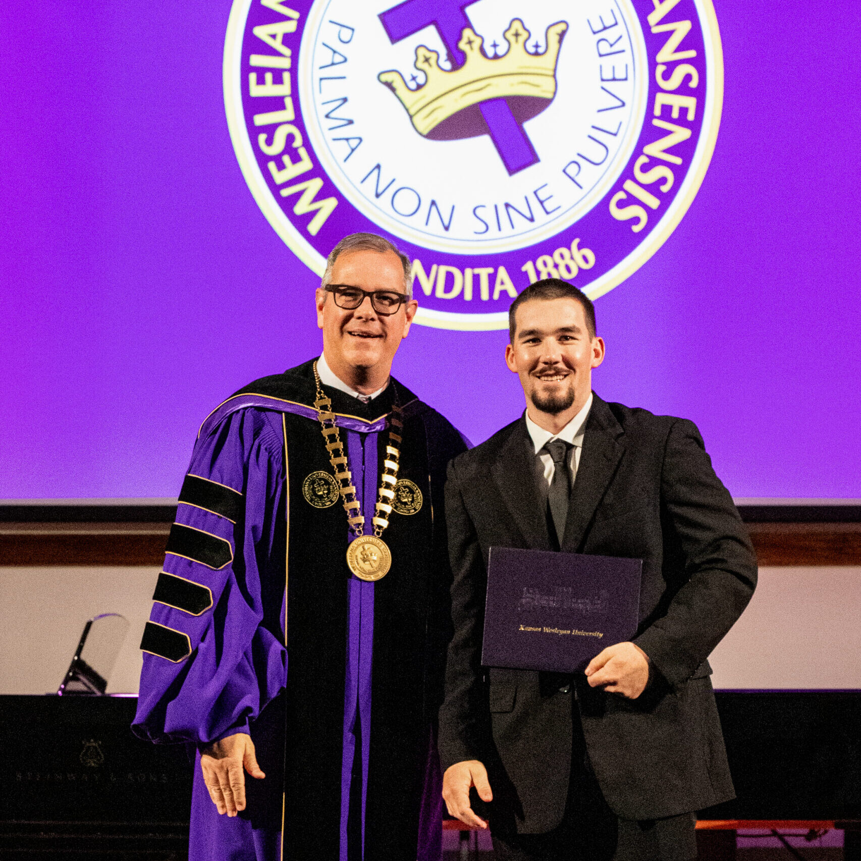 Man with diploma and president