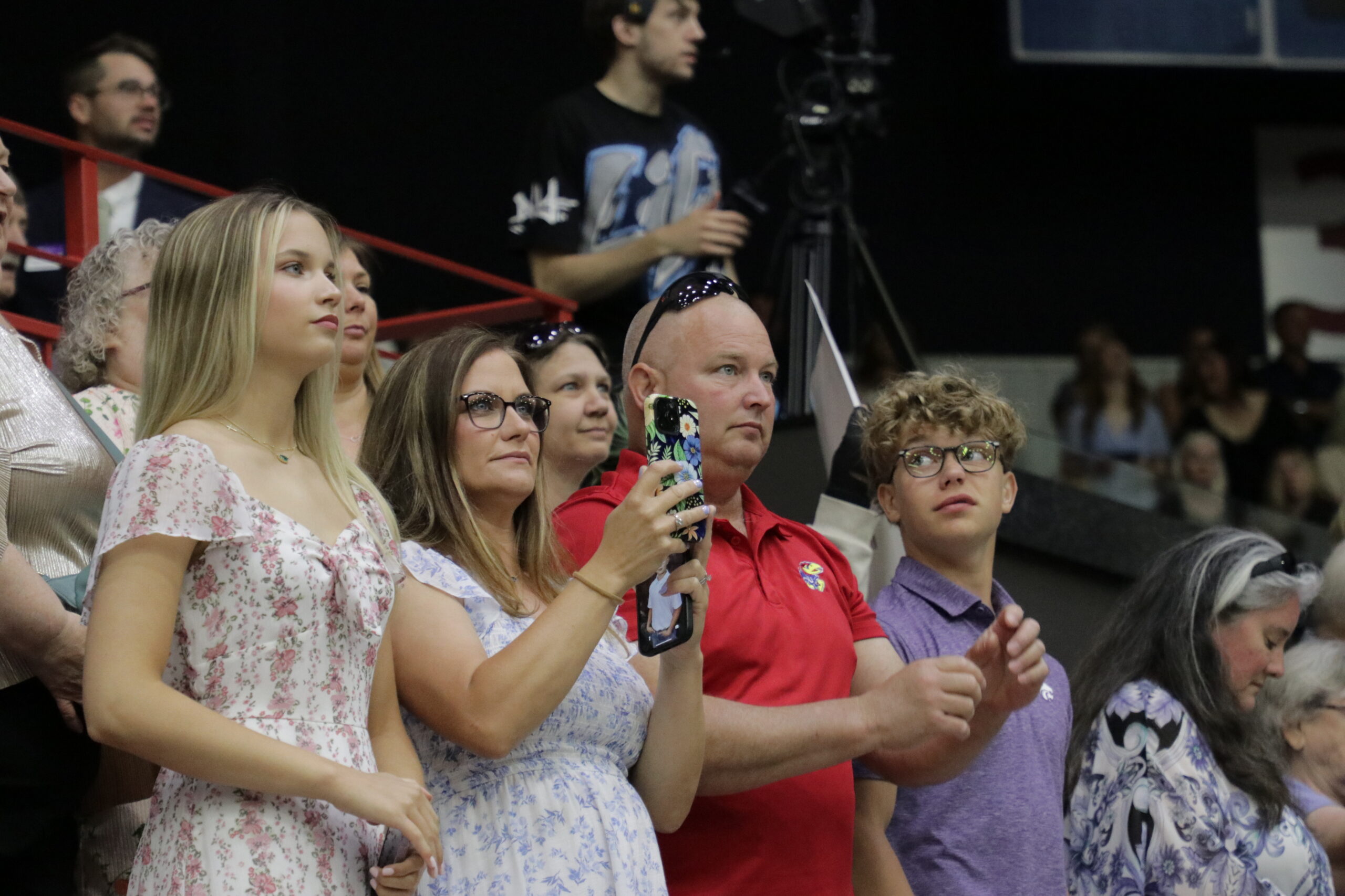 Family watching graduation ceremony