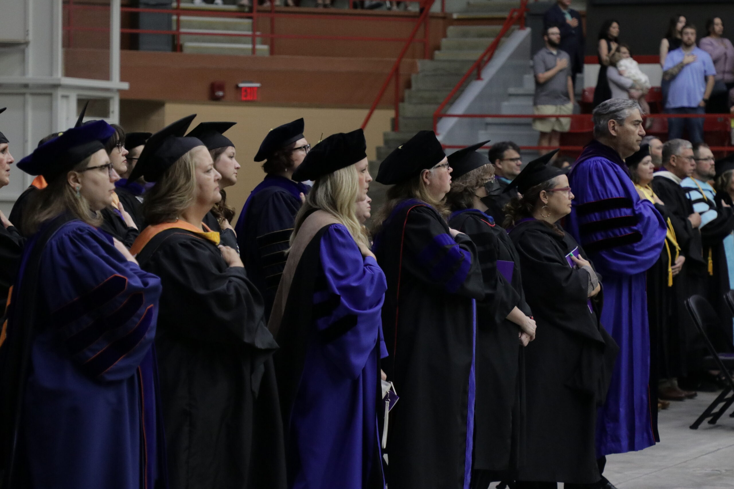Faculty at attention for anthem