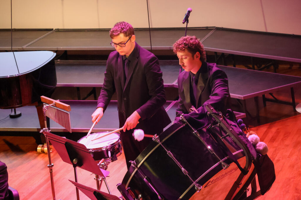 Two men playing percussion instruments
