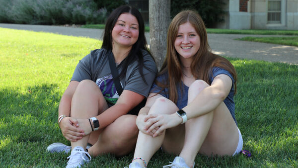 Students on grass at move-in