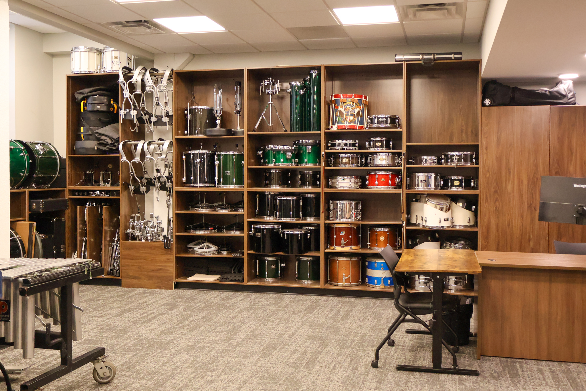 Drums stored in music center.
