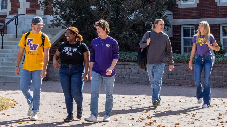 Students walking on sidewalk