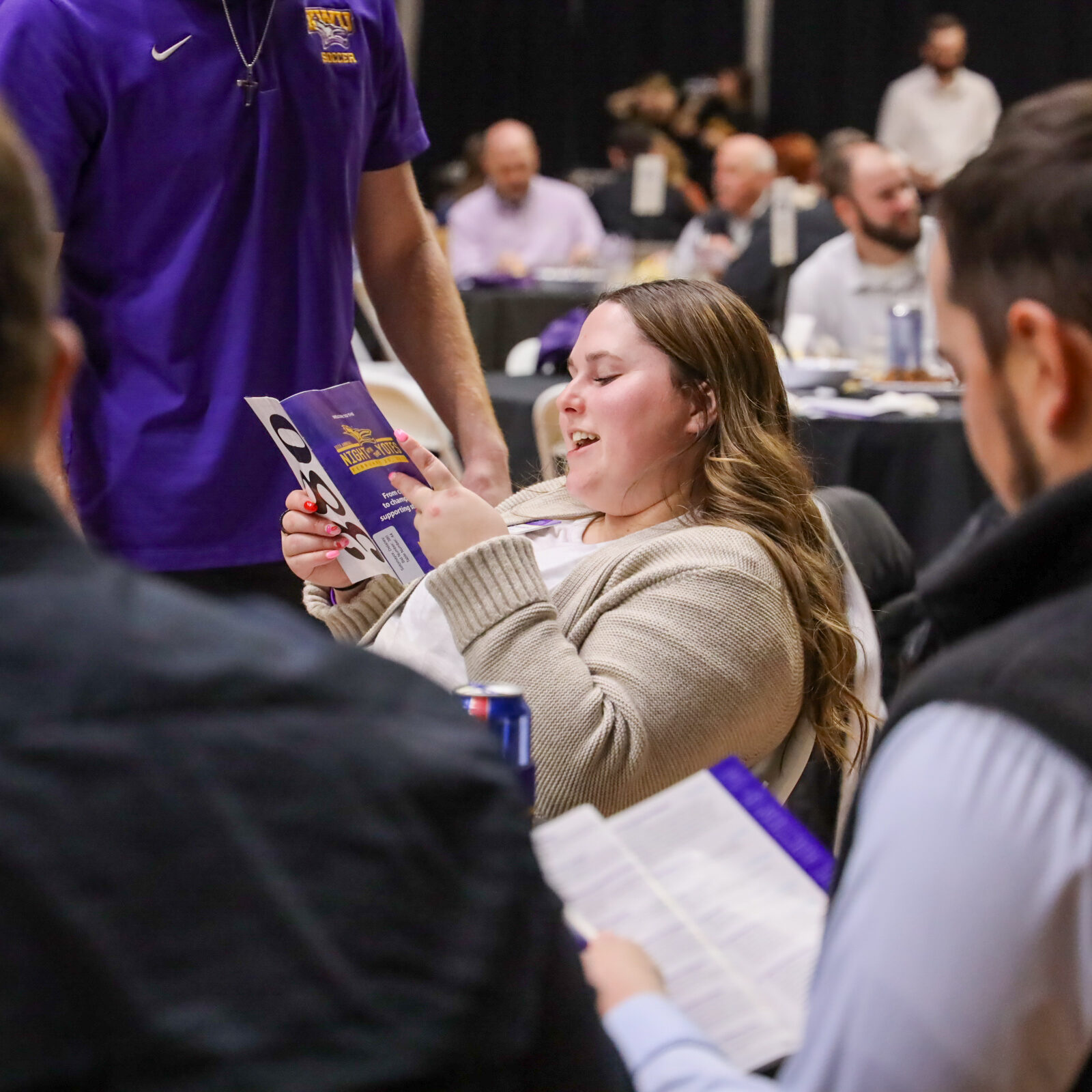 Woman reading program at table