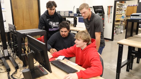 Students collaborating in physics lab