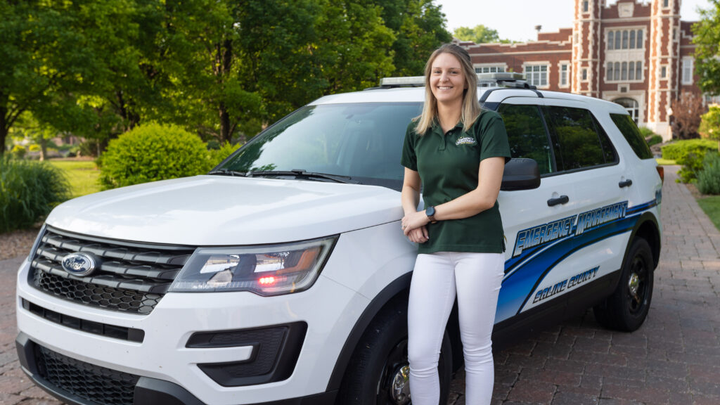 Alum in front of vehicle