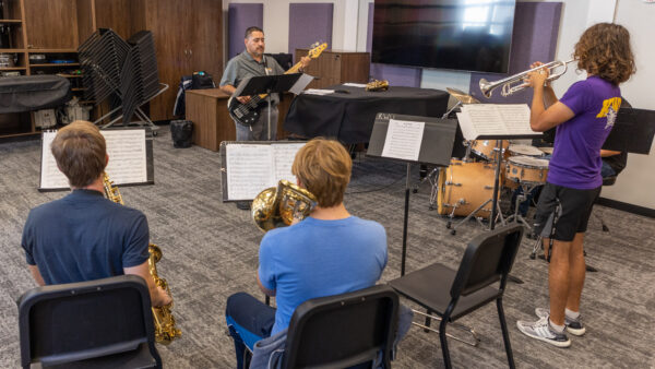 Music instructor with group of students