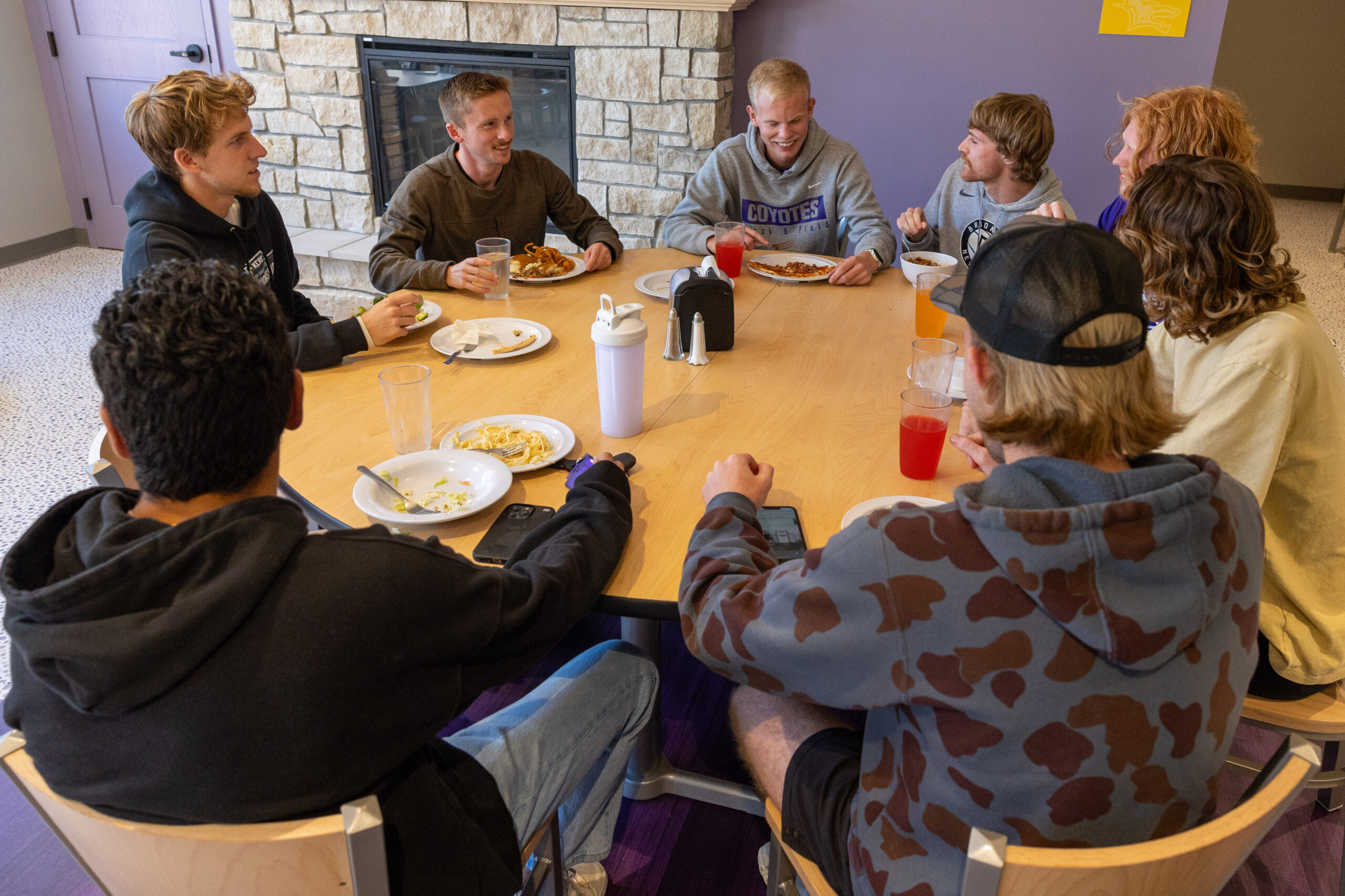 Students at a round table in Bieber Dining Hall