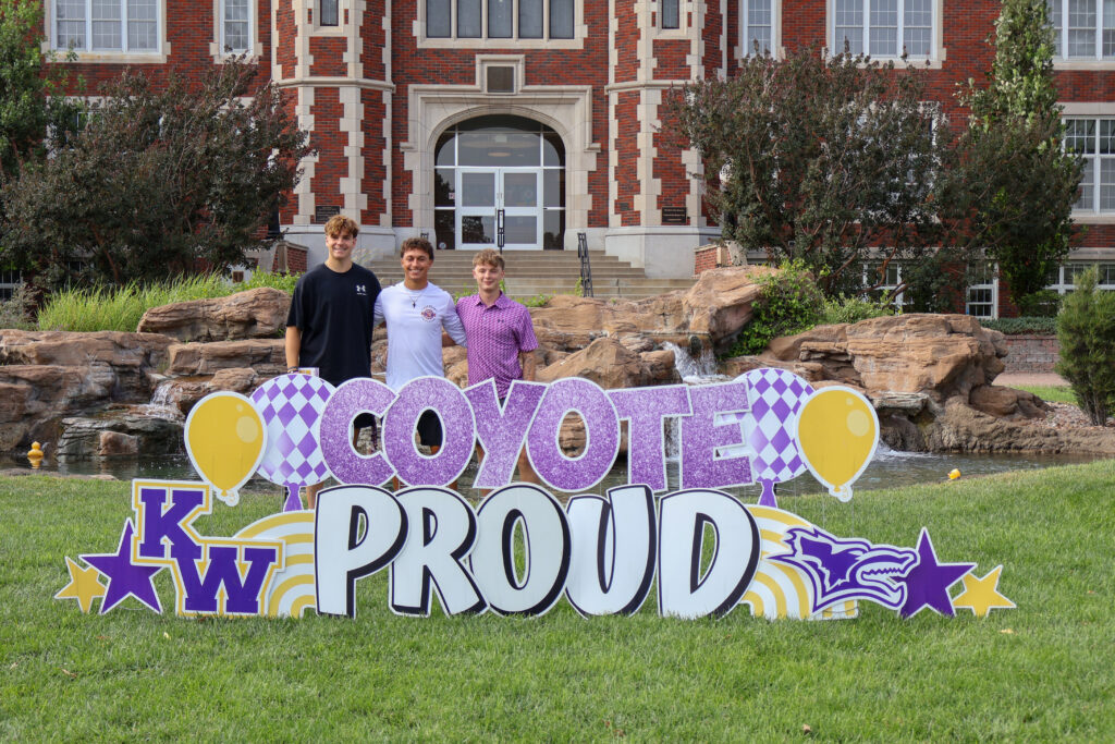 Family behind sign