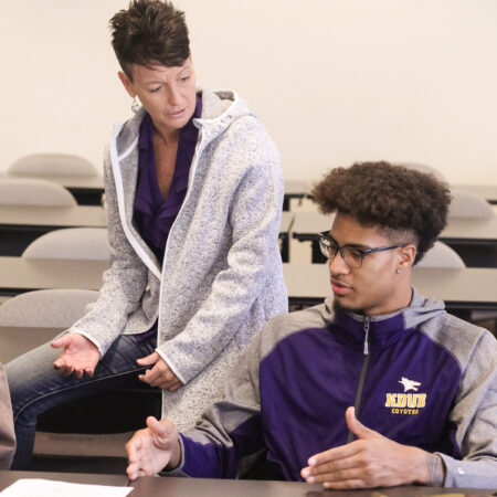 Professor and student in class