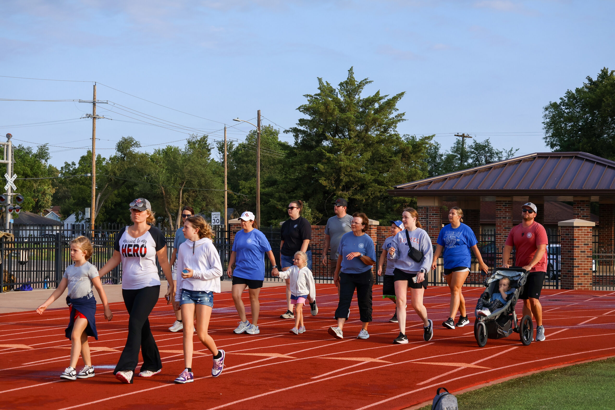 group of people walking around track