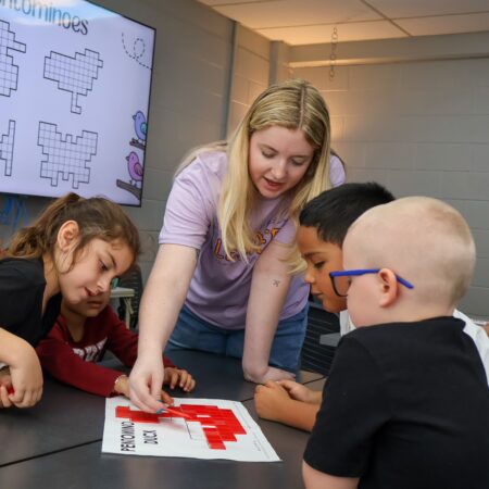 College students teaching kindergarten class