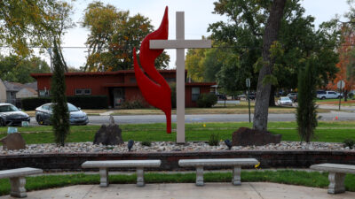 UMC cross flame symbol