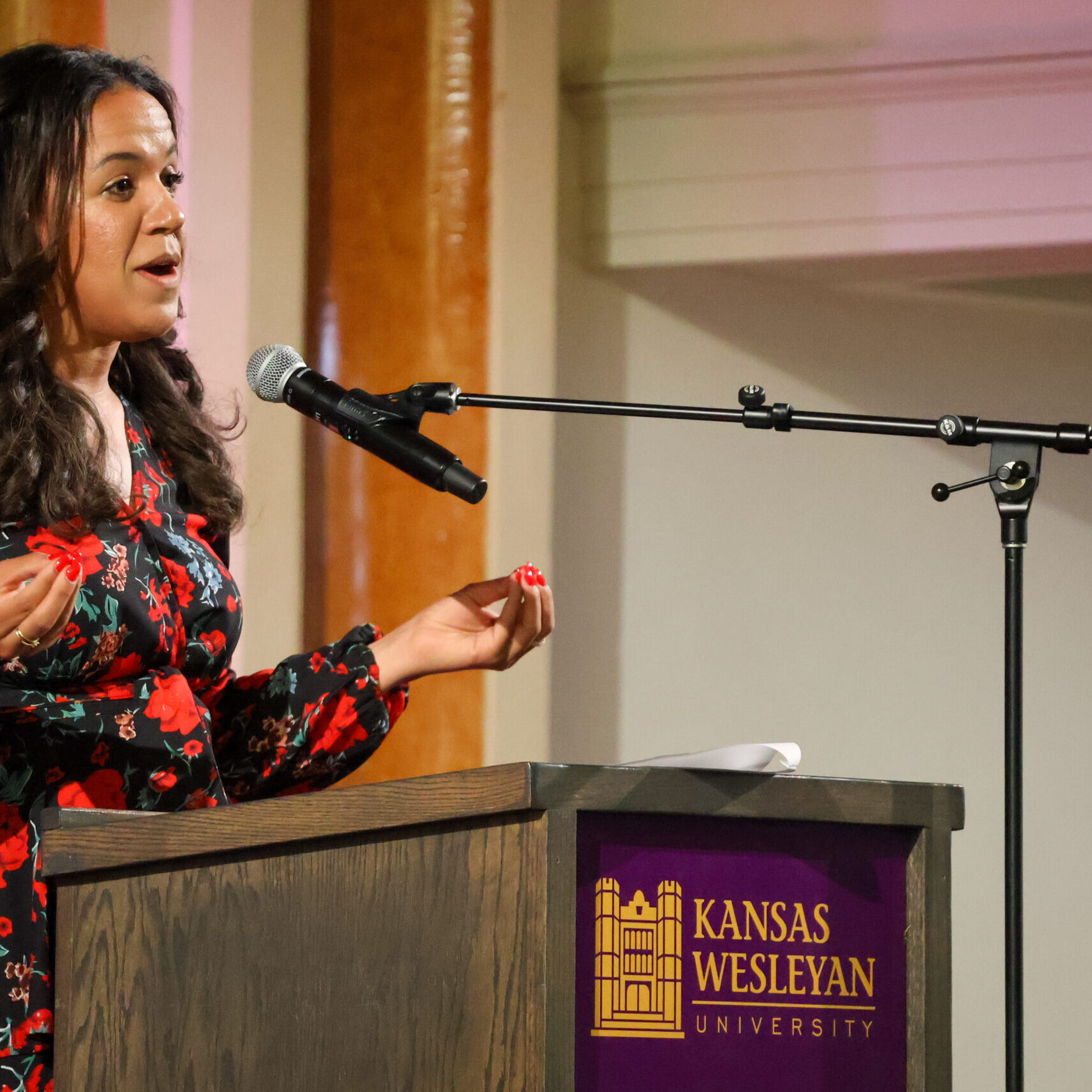 Woman giving speech on stage