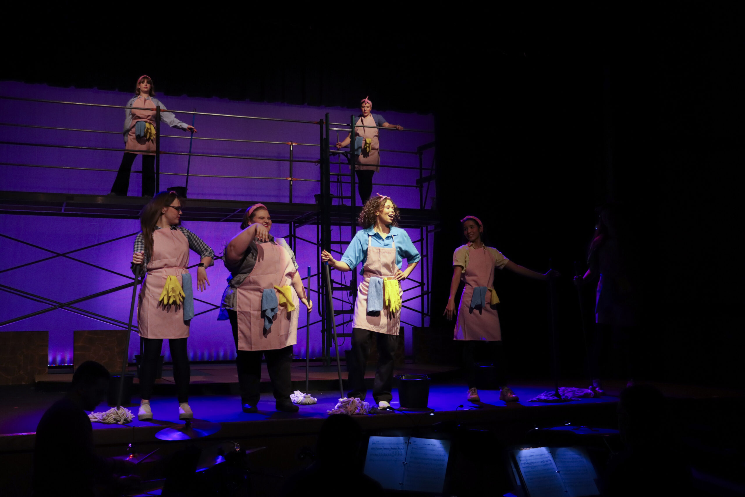 Students on stage together during muscial