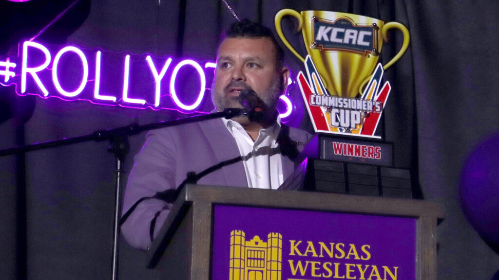 A man stands at a podium